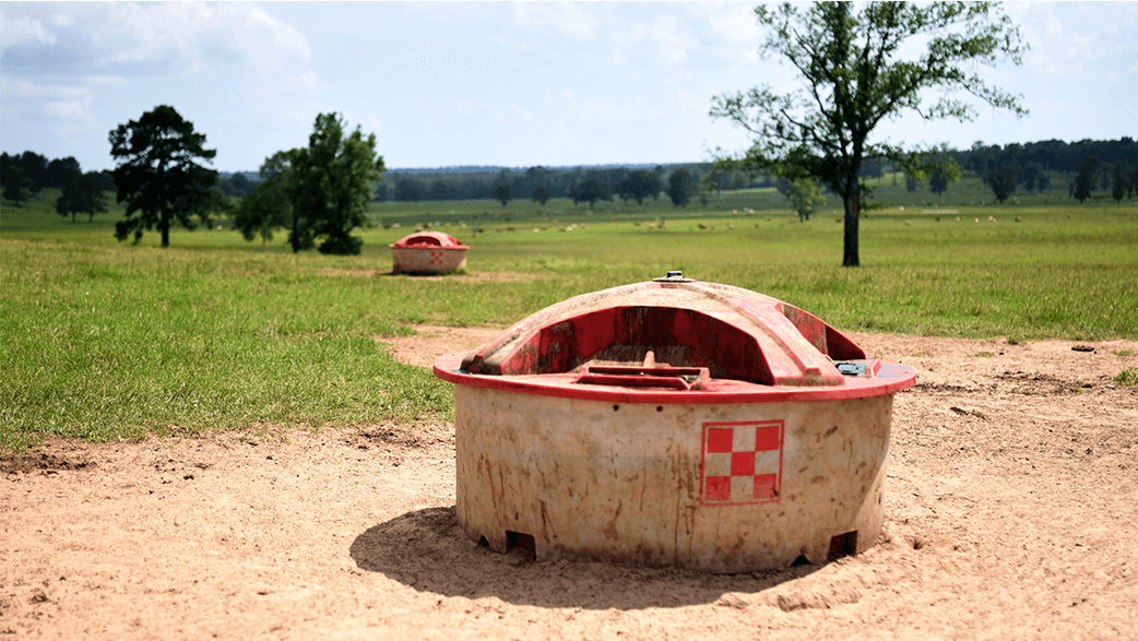 A Purina Feed Bin In A Field