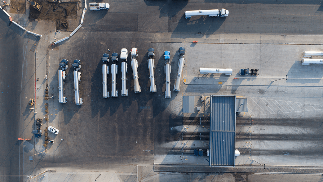 An Aerial View Of Milk Trucks