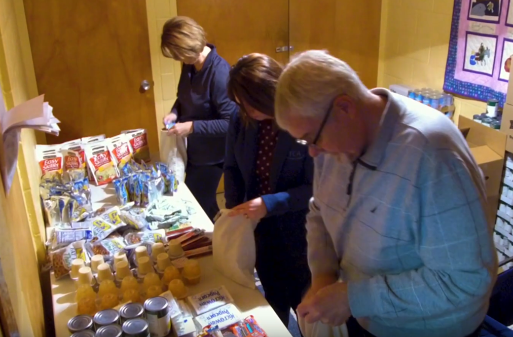 Volunteers Working At A Food Shelf
