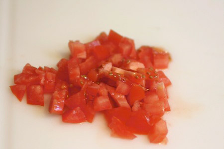 tomato, chopped, cutting board