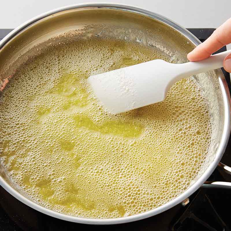 Stirring bubbling, melted butter