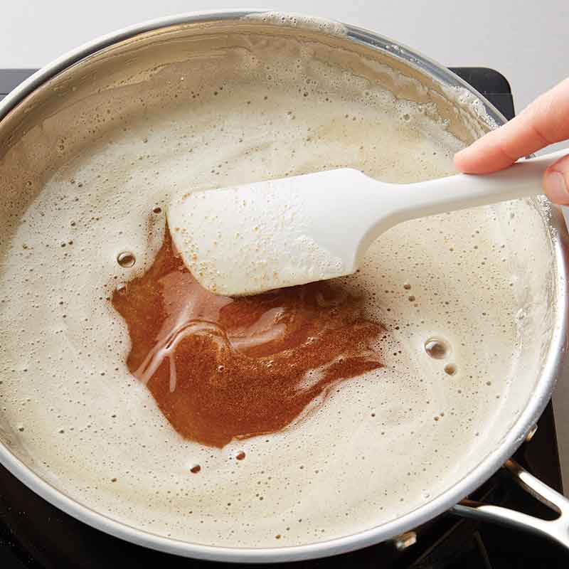 stirring brown butter in pan