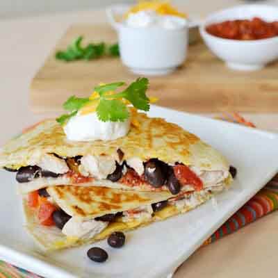 Cheese, bean and chicken quesadillas